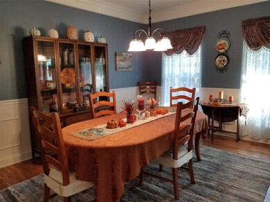 Formal dining room with double crown molding and w