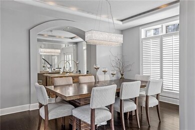 An open Formal Dining Room with ambient lighting a