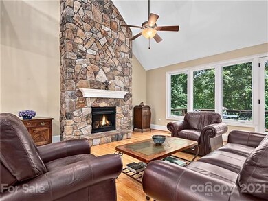 Great Room with stone fireplace and gas logs.