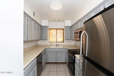BETTER VIEW OF THE KITCHEN WITH FRIDGE