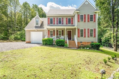 View of front of property with a front yard and co