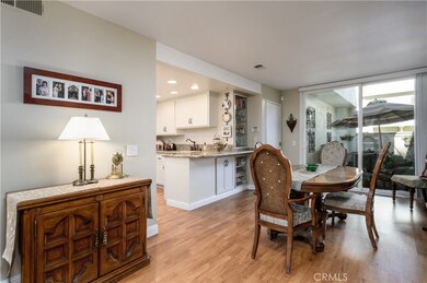 Spacious dining area adjacent to kitchen and sliding doors to private patio.