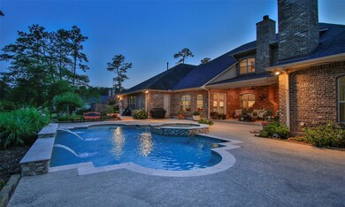 A sunset view of the back of this home.  Beautifully landscaped front and back!