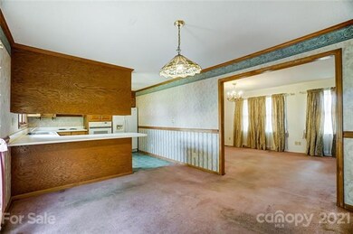 Kitchen and dining view to great room.