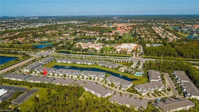 Birds eye view of property with a water view