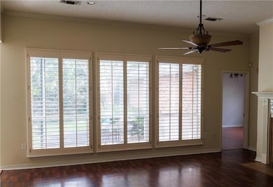 Den with custom plantation blinds