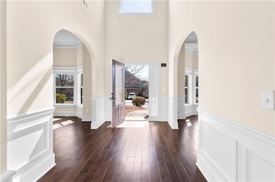 Entrance foyer featuring a towering ceiling, healt