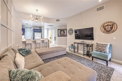 Living area featuring light tile patterned floorin
