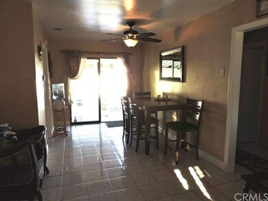 Dining room with sliding doors leading out to pati
