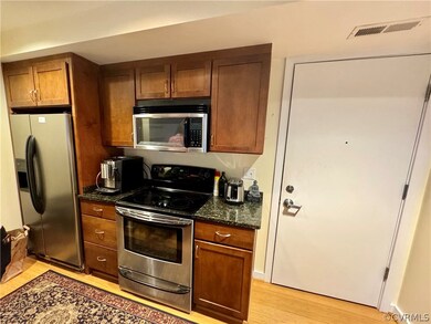 Kitchen featuring appliances with stainless steel