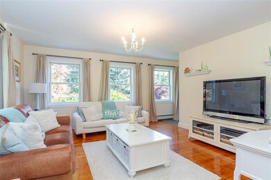 sunlit living room w/ beautiful wood...