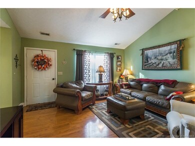 Living room has vaulted ceiling