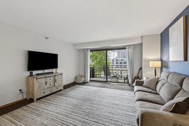 Light and bright living room area with an oversized sliding door to the balcony.