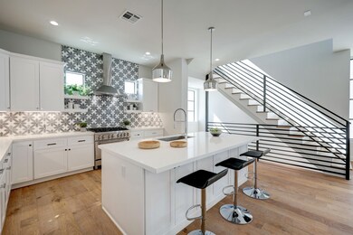 The bright and open kitchen is nicely appointed wi