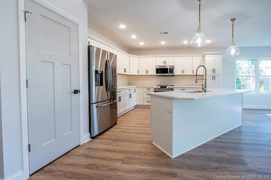 Upgraded three panel door opens to pantry on thele