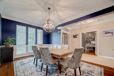With floor to ceiling windows this formal Dining Room is Light and Bright.