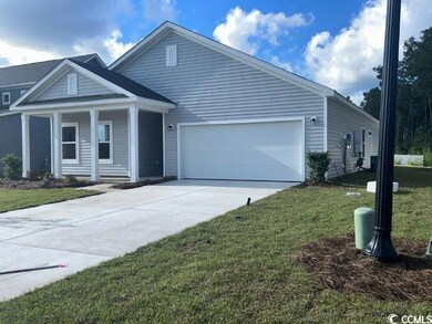 View of front of property featuring a garage and a