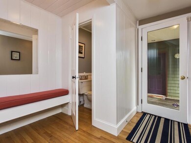 Side Entrance hall w/half bath and...