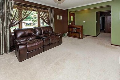 Living Room. Hardwood floors under the carpet.