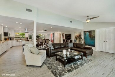 living room and kitchen to the left. To the right, french door leads to 3rd bedroom - currently an office room.
