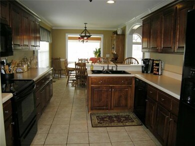 The big kitchen has lots of cabinets and counter space.