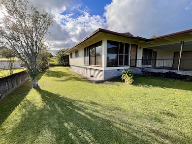 Yard goes wraps around sides of home to the nice private back yard.