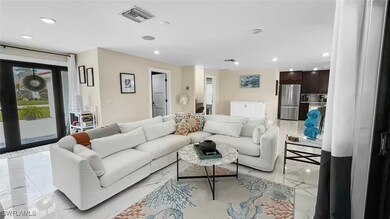 Living room featuring healthy amount of natural light and recessed lighting