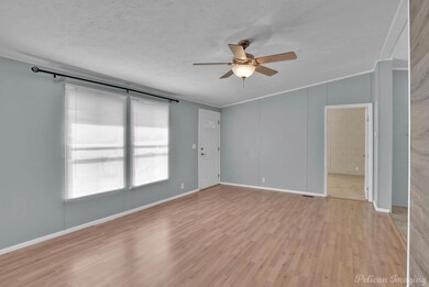 Spare room featuring light wood-type flooring, cei