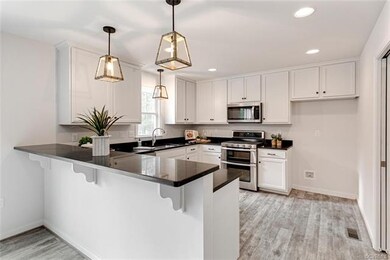 Kitchen has Painted Cabinets, Granite Tops & Stain