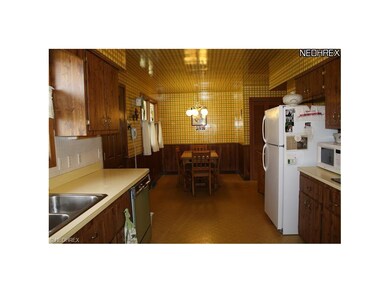 large eat in kitchen with access to laundry and co