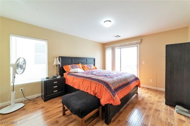 Bedroom featuring light wood-type flooring, multip
