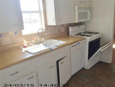 Kitchen. Cermic tile floor and gas cook stove