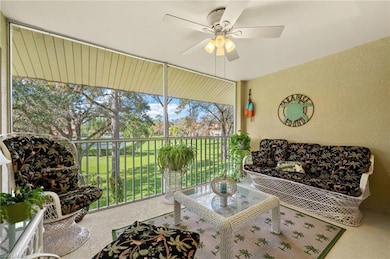 Sunroom with a ceiling fan