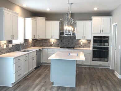 Under cabinet lighting, led's, and island pendants make this a very well lit kitchen!.jpg