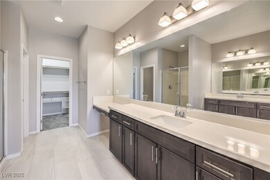 Bathroom with a spacious closet, toilet, a shower
