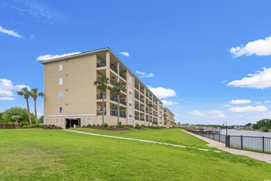 View of property with a water view