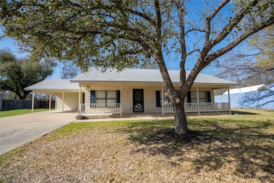 Single story home featuring driveway, fence, cove