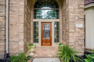 The front covered porch offers a place to greet yo