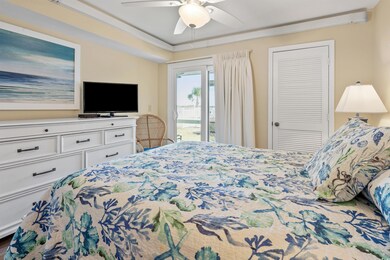 Bedroom with access to exterior, ceiling fan, and 