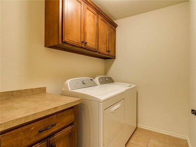 Laundry room with storage. Right off the entry way