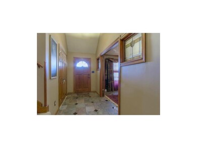 Front foyer has vaulted ceiling, large coat closet