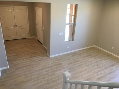 Foyer at entry with double door coat clo