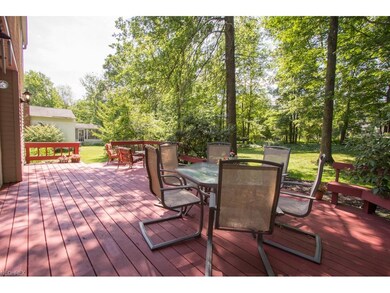 Expansive deck for entertainment overlooking treed