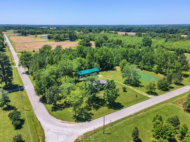 Circle drive as home sits on curve in road
