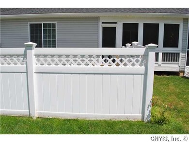 Exterior Back Vinyl privacy fence for your back yard and a lovely covered screened porch for enjoying your mornings and evenings!