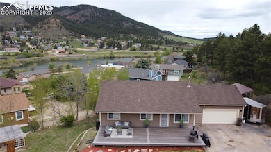 View from above of property featuring a water and mountain view