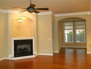 Offering tall ceilings, magnificent trim & moldings, hardwood floors throughout the main level & a corner fireplace with gas logs.