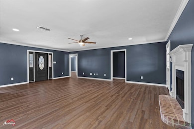 Unfurnished living room with baseboards, visible v
