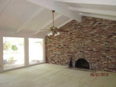 Oversized windows light the huge living room.