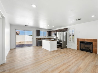 Kitchen featuring stainless steel appliances, dark
